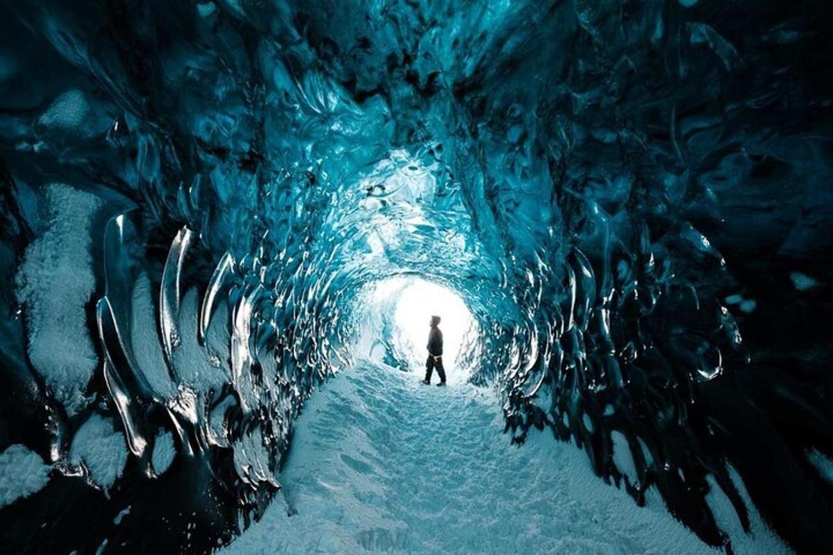 a person walking through an ice cave