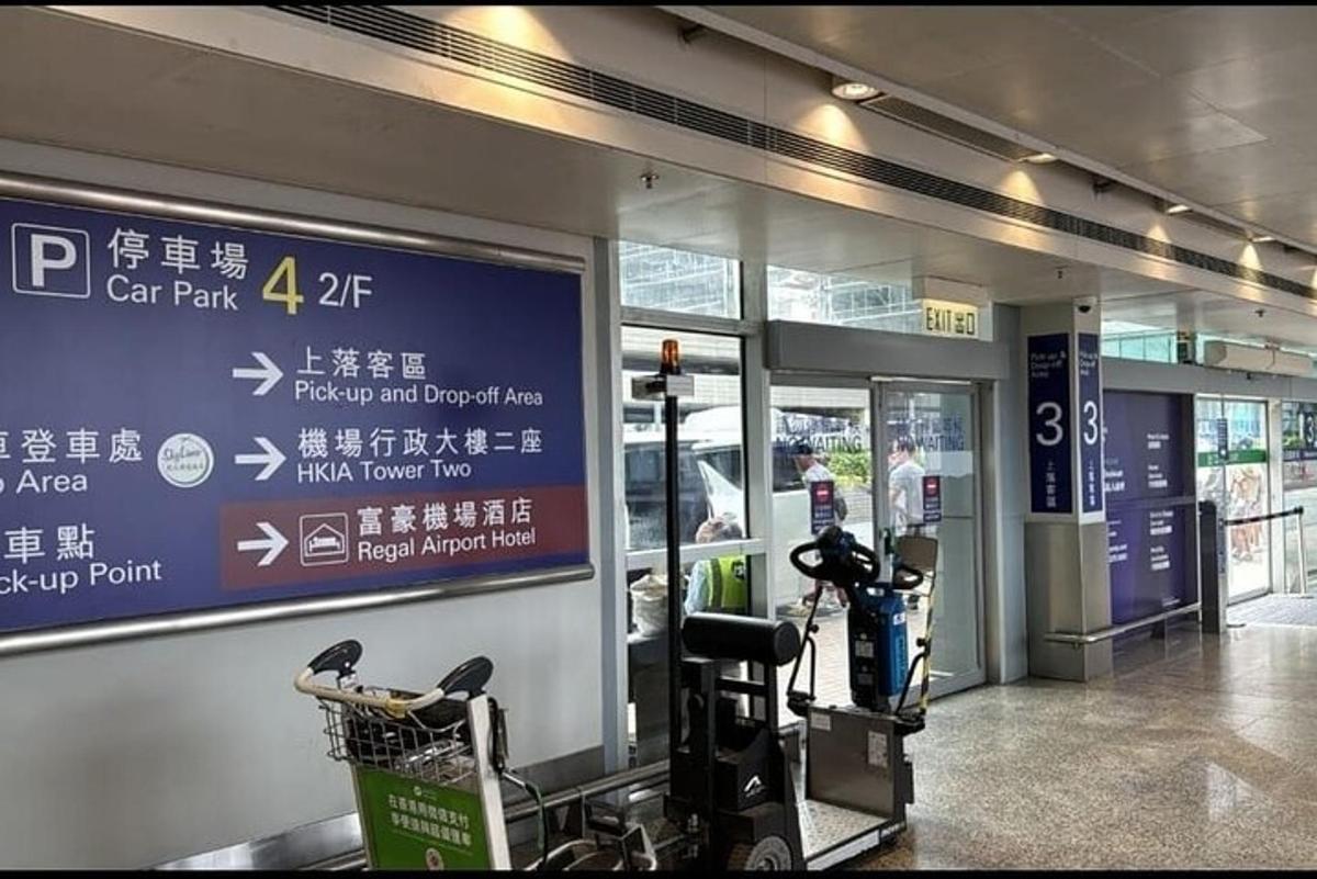 a gym in a shopping mall with a sign