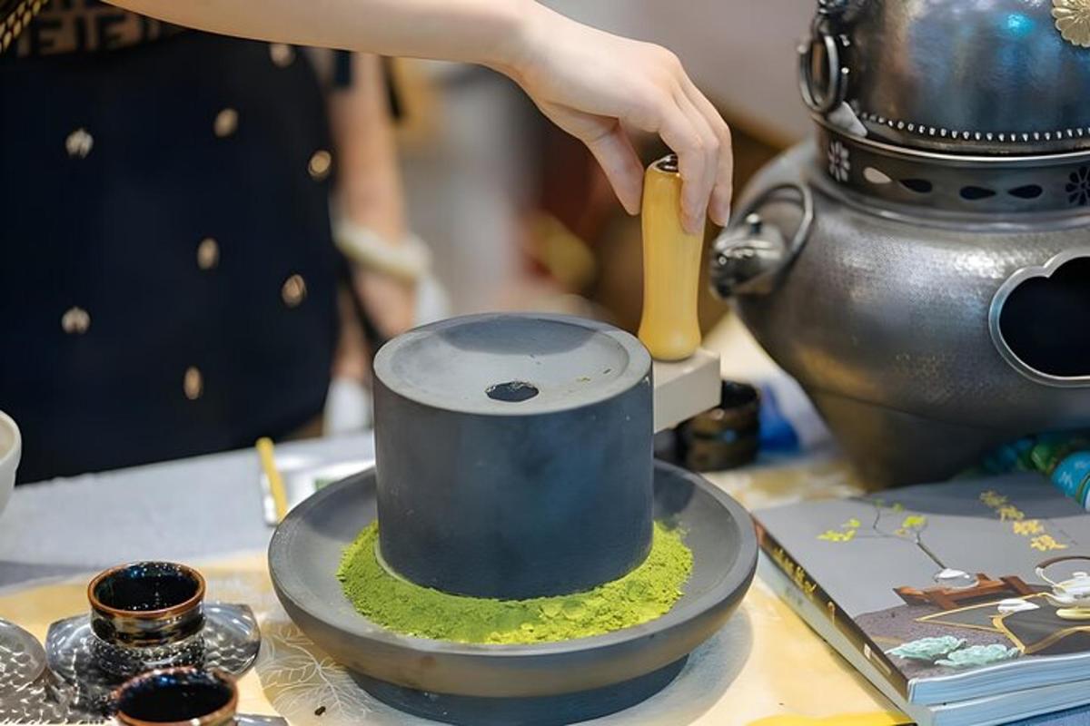 a person adding moss to a cup on a table