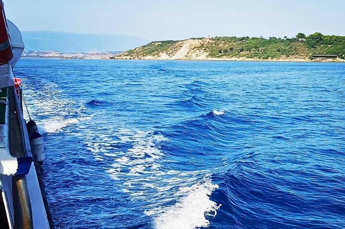 a boat in the middle of a large body of water