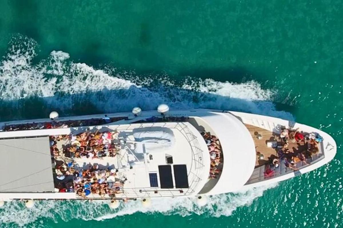 a group of people on a boat in the water