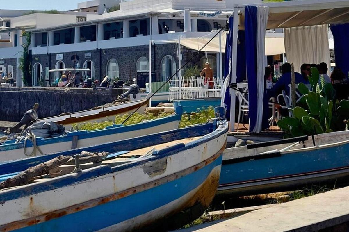 two boats are docked next to a building