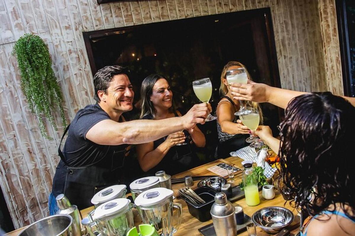 a group of people holding up champagne glasses at a table