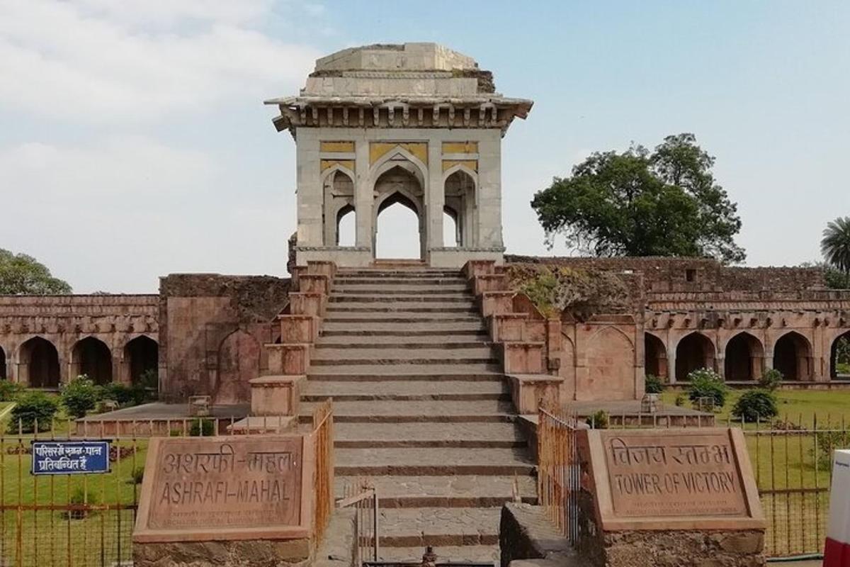 a building with stairs leading up to a monument