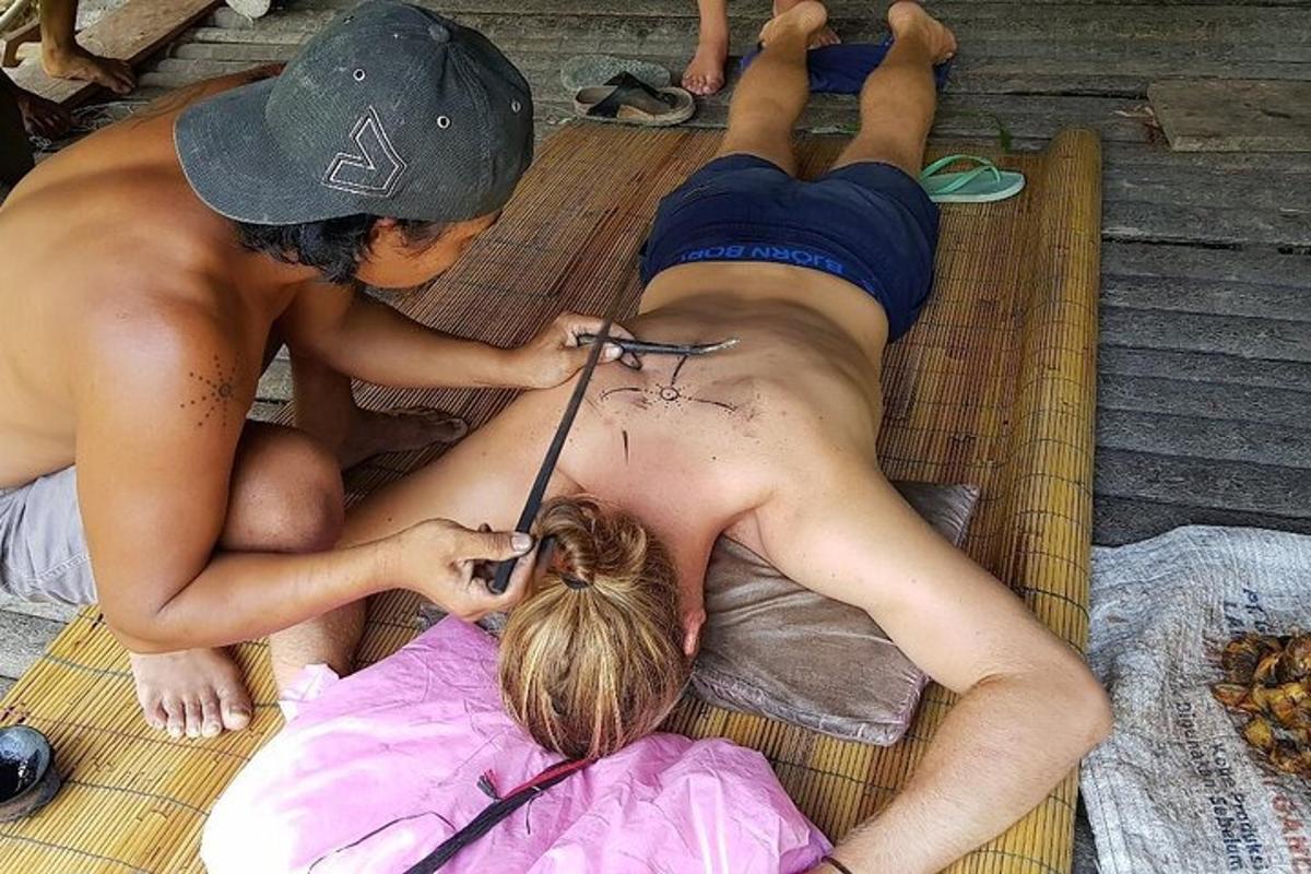 two young men cutting a girls hair on a raft
