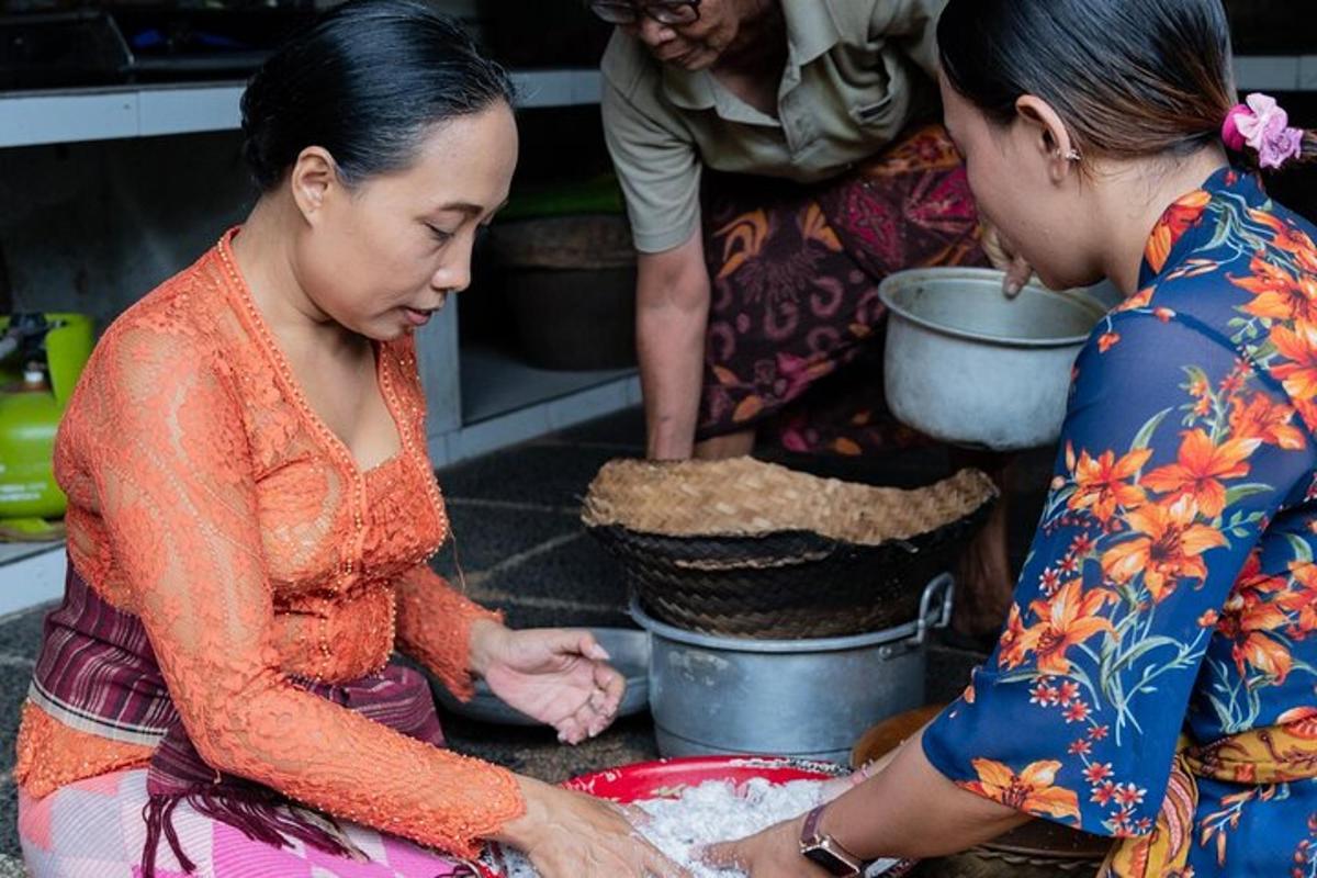 two women are preparing food in a kitchen