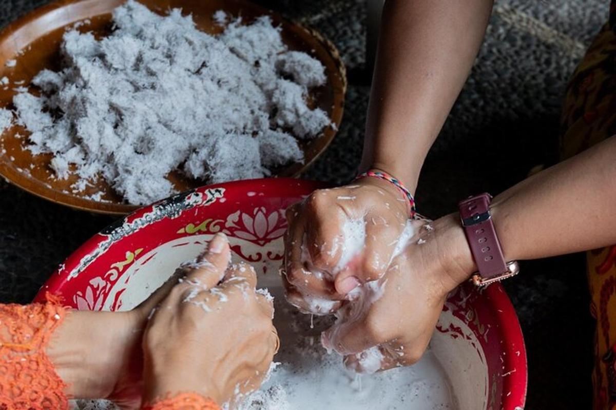 a person washing their hands in a bowl of sugar