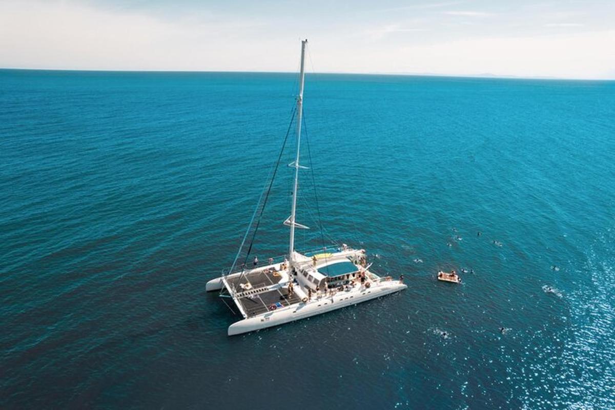 a boat sitting in the middle of the water