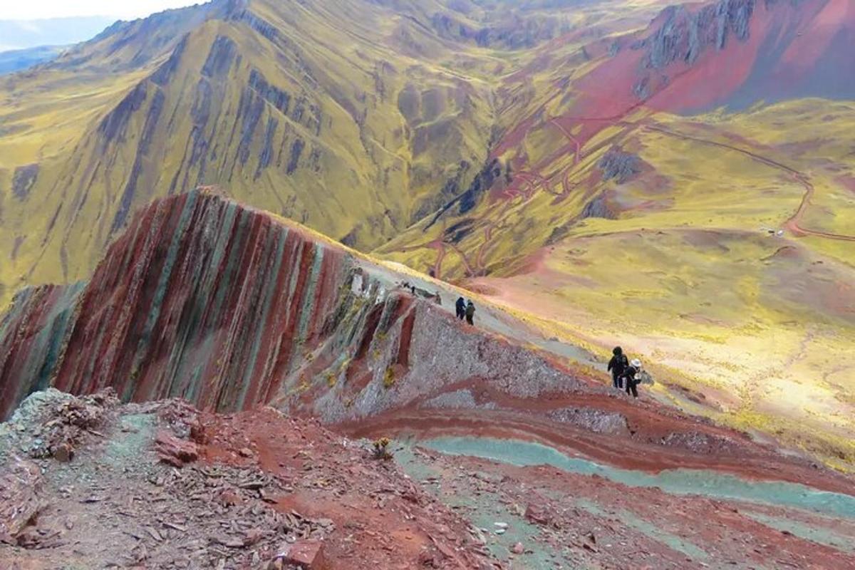 a painting of people standing on a mountain