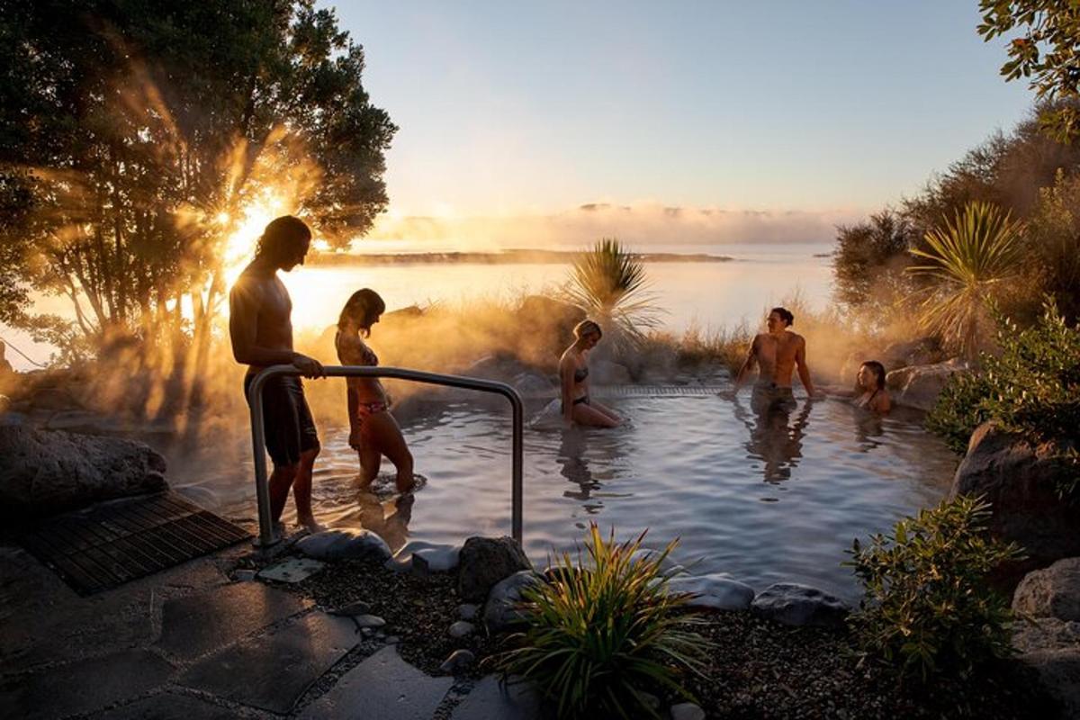 a group of people standing in a hot tub