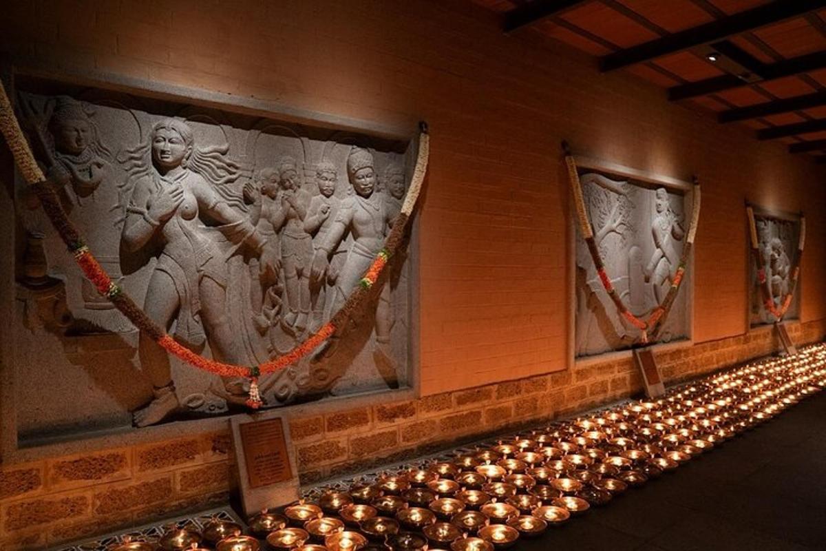 a room with a wall with paintings on it with lights