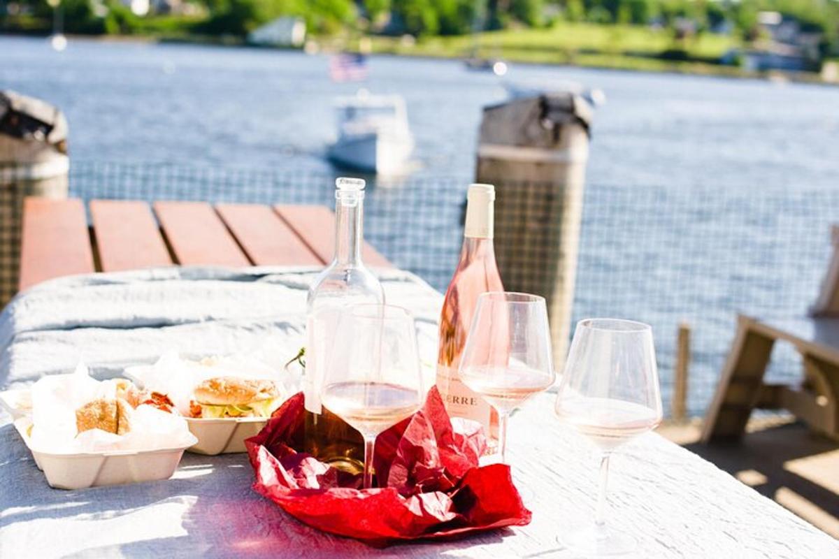 a table with two wine glasses and a bowl of food