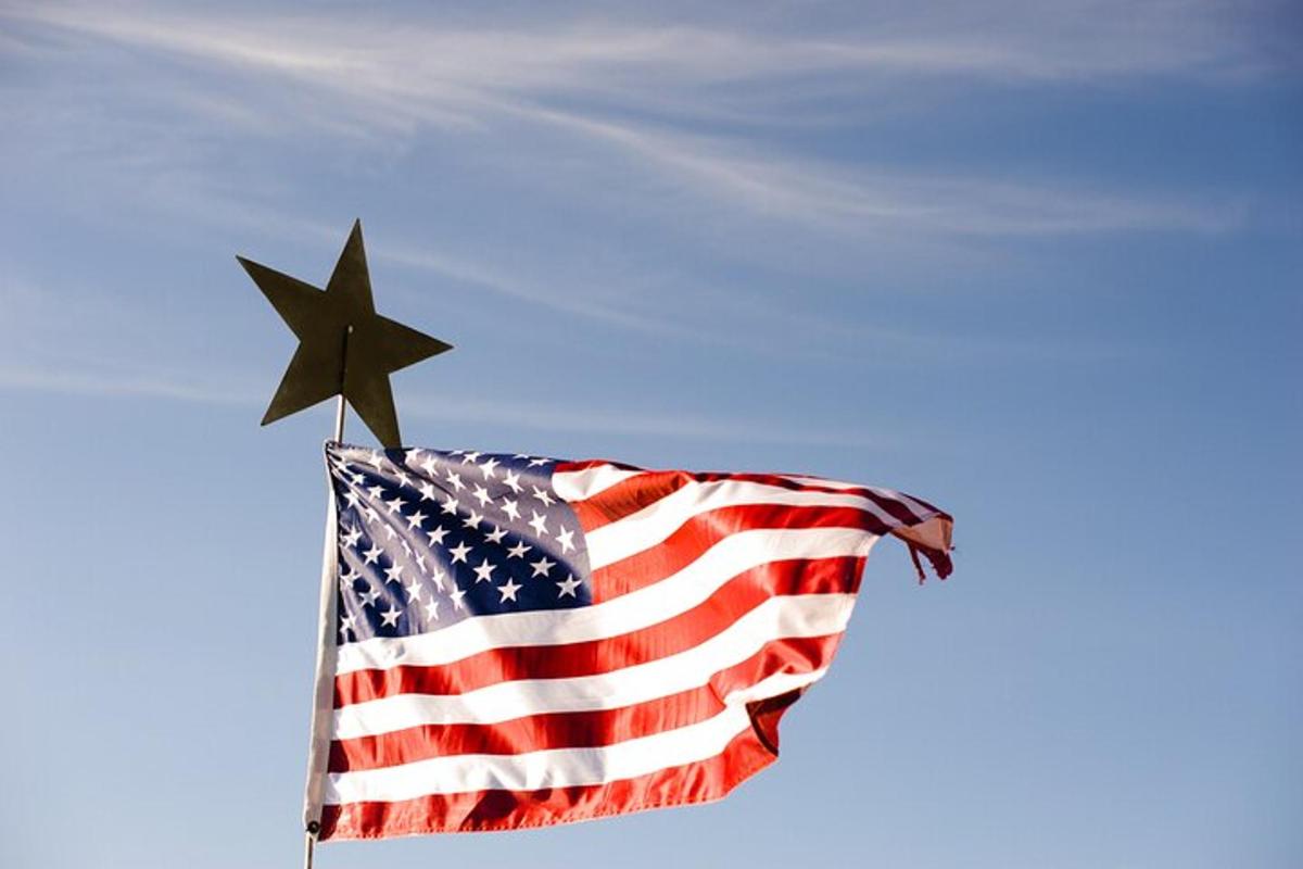 an american flag with a black star on it