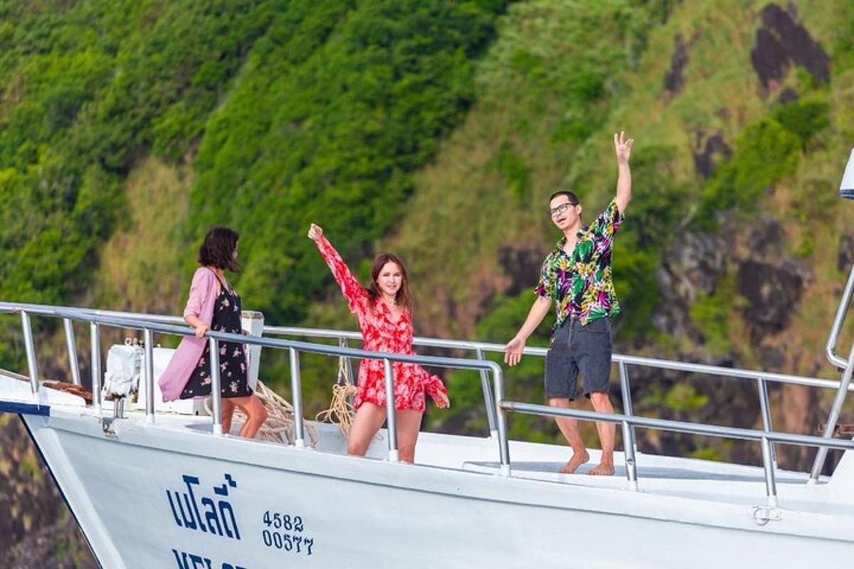 a group of people standing on a boat