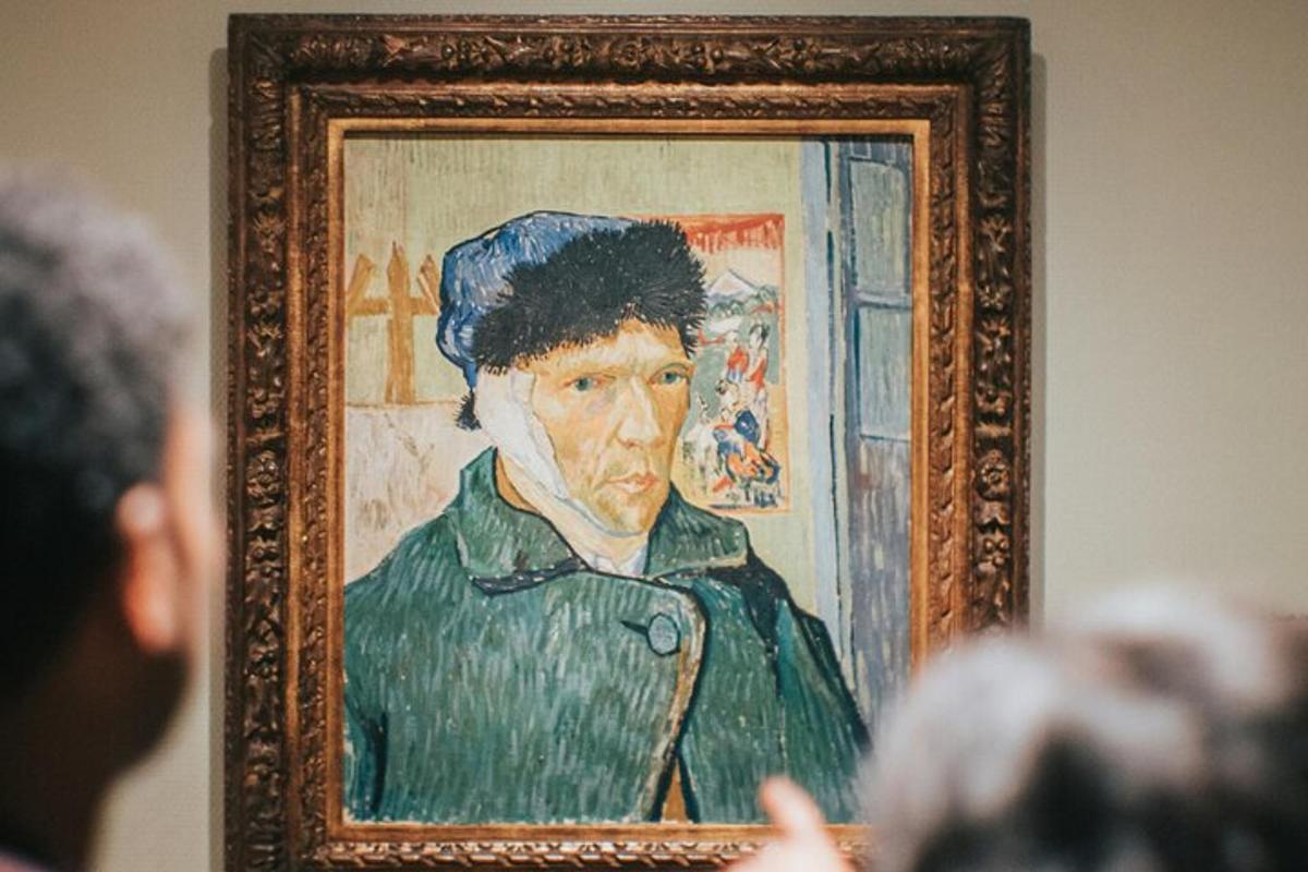 a person is looking at a painting of a man
