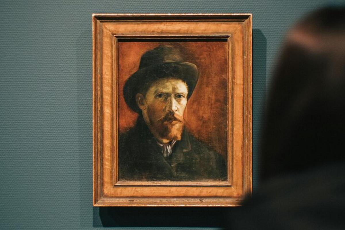 a painting of a man in a hat on a wall