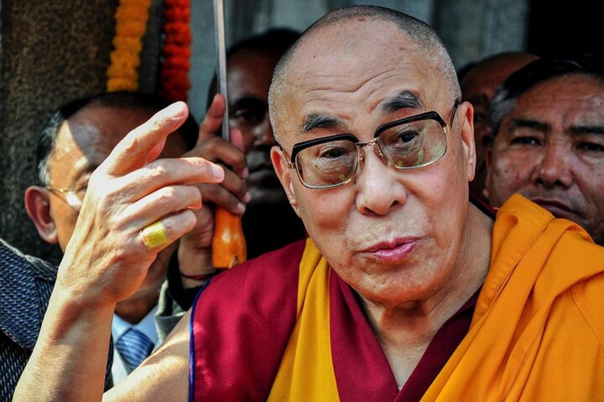 an older man wearing glasses and a robe