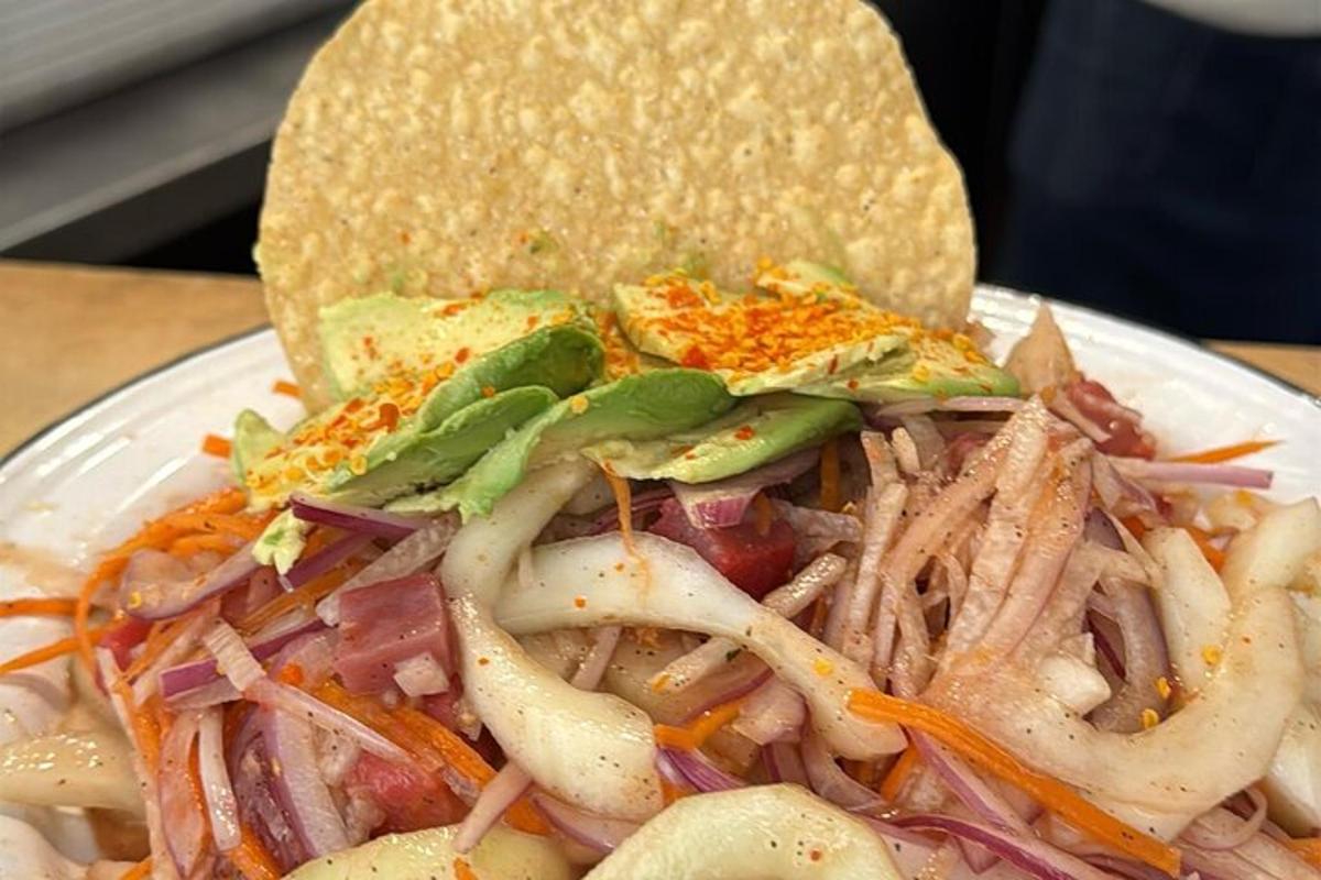 a plate of food with a sandwich on a table
