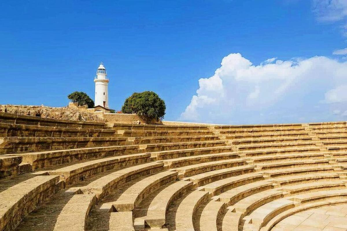 a large amphitheater with a lighthouse in the background