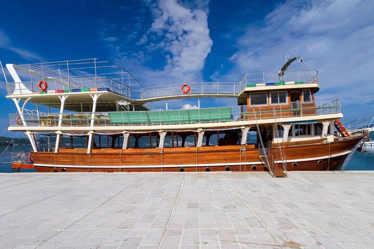 a large boat is docked at a pier