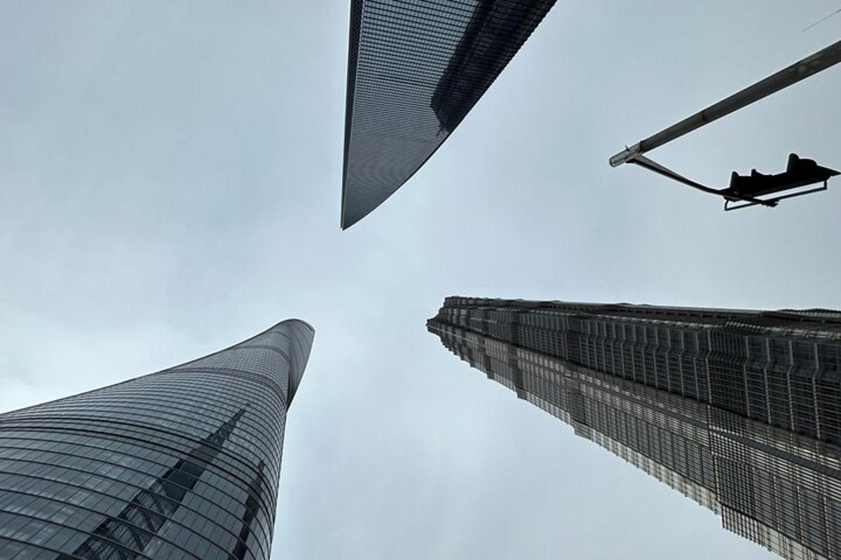 a helicopter flying over a building and a skyscraper