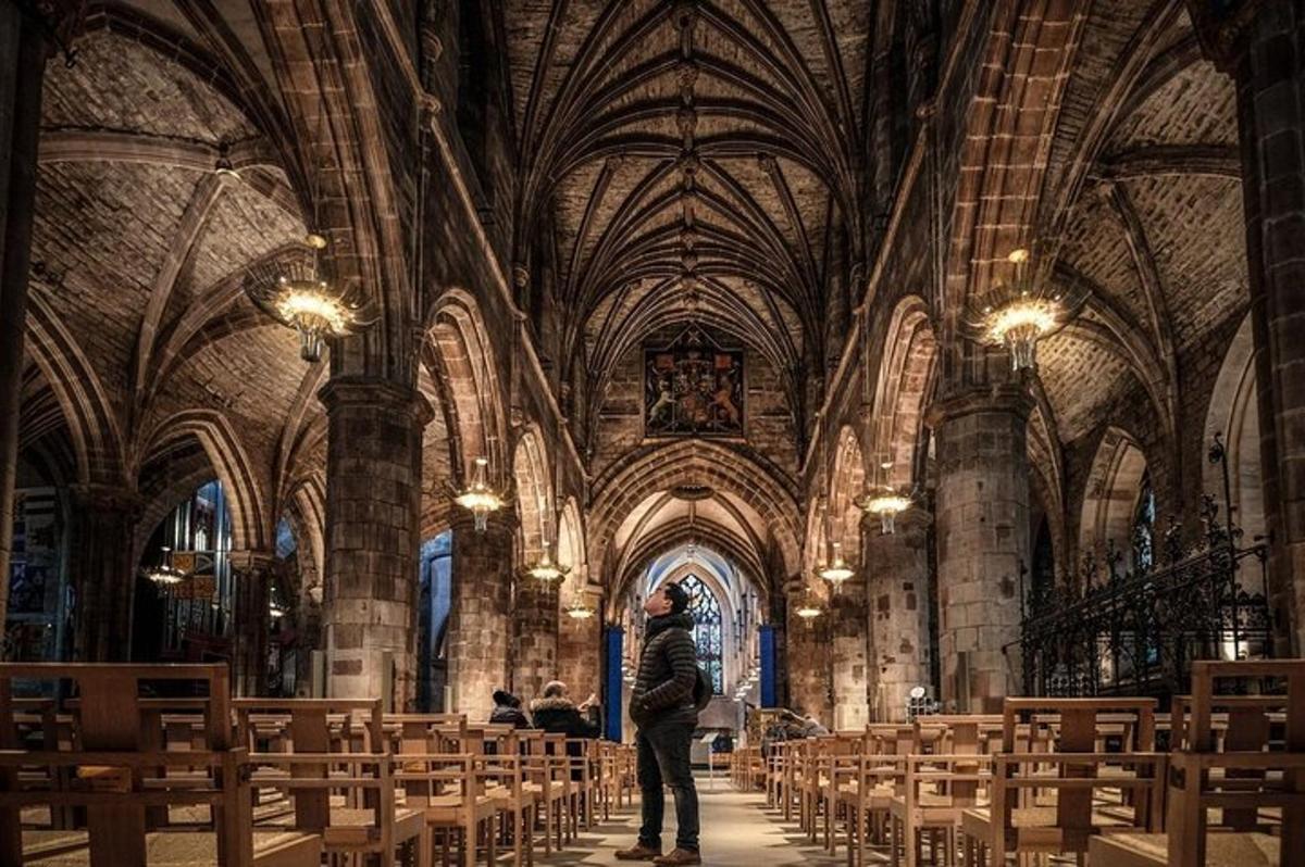a man standing in a large cathedral with chairs
