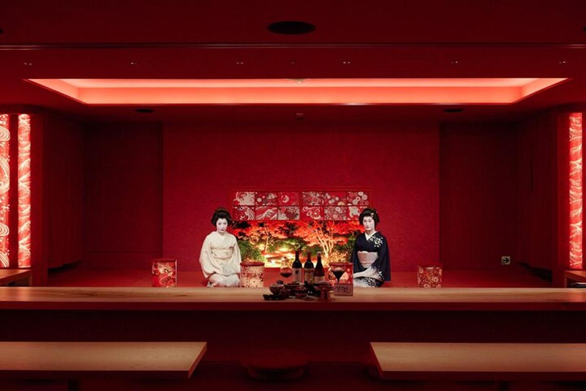 two people in a red room with a christmas tree