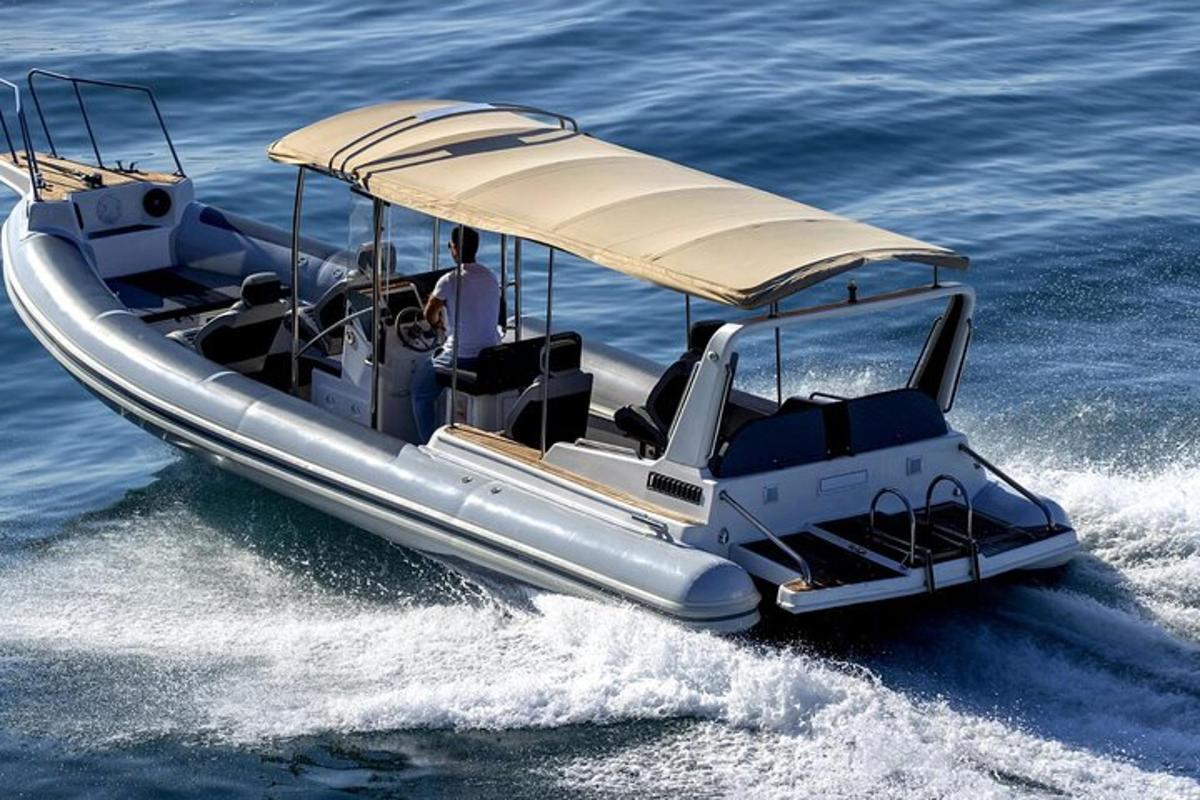 a silver boat in the water on the water