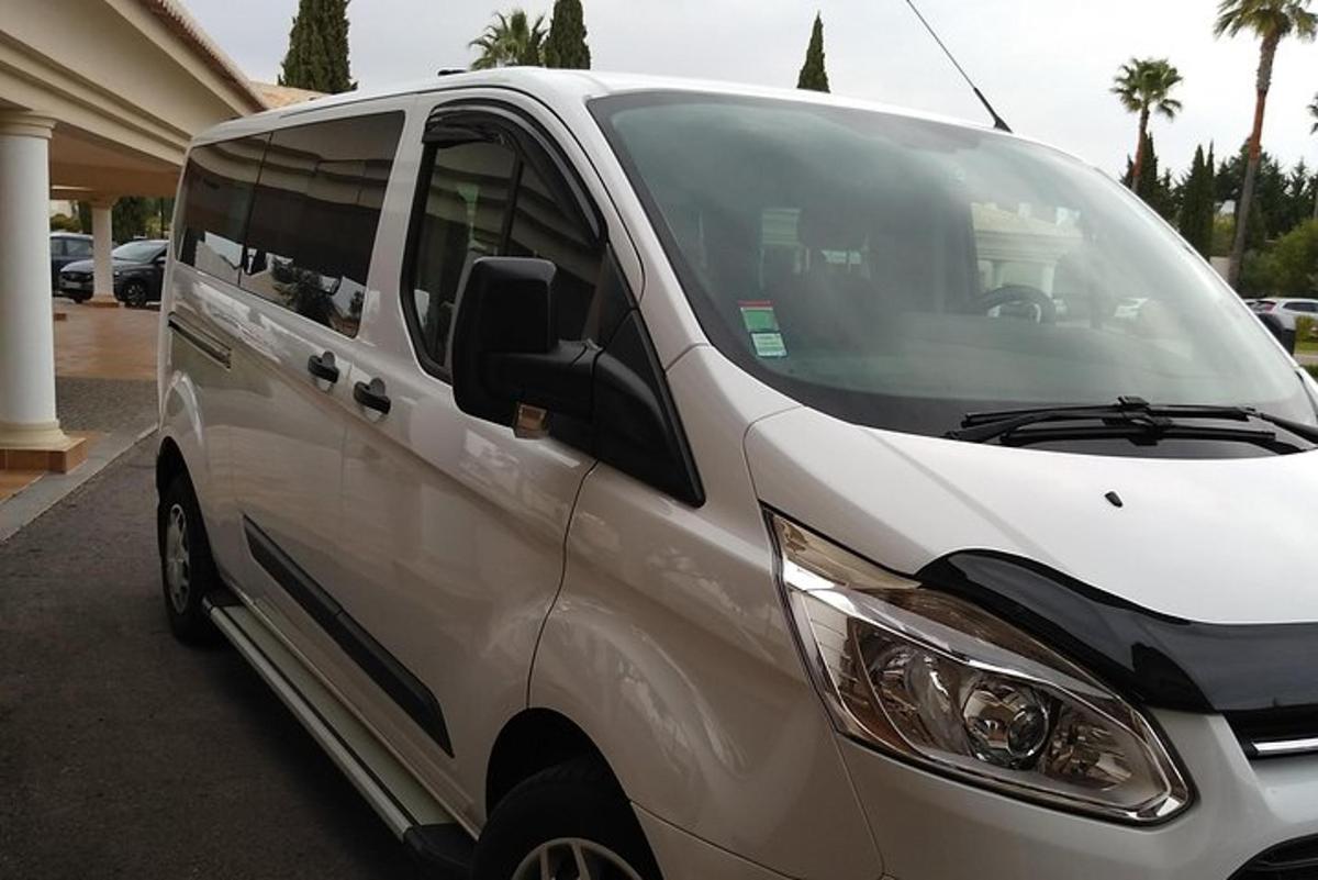 a white van parked in a parking lot