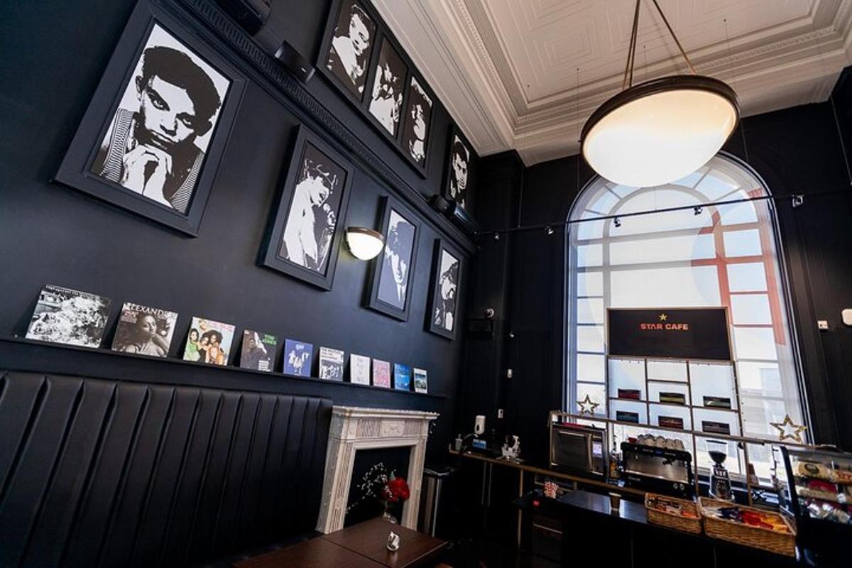 a restaurant with a fireplace and pictures on the wall