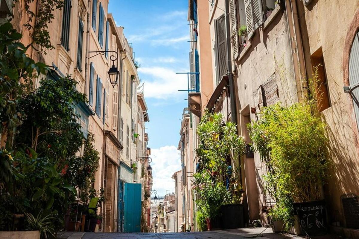 an alley in a city with tall buildings
