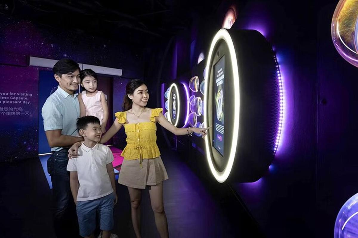 a family standing next to a clock in a room