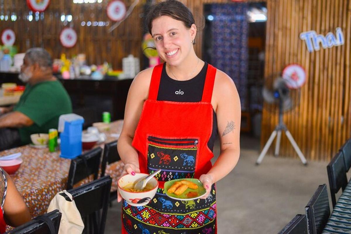 a woman is holding a bowl of food
