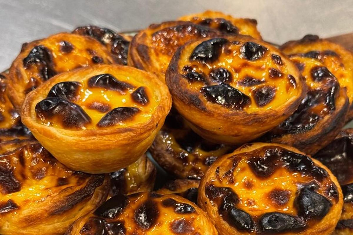 a pile of pastries with cheese and raisins