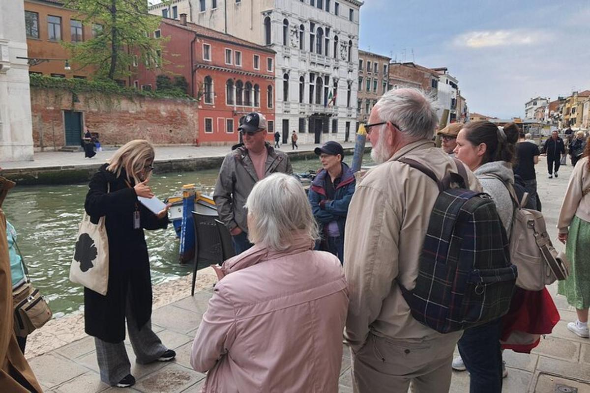 a group of people standing next to a river