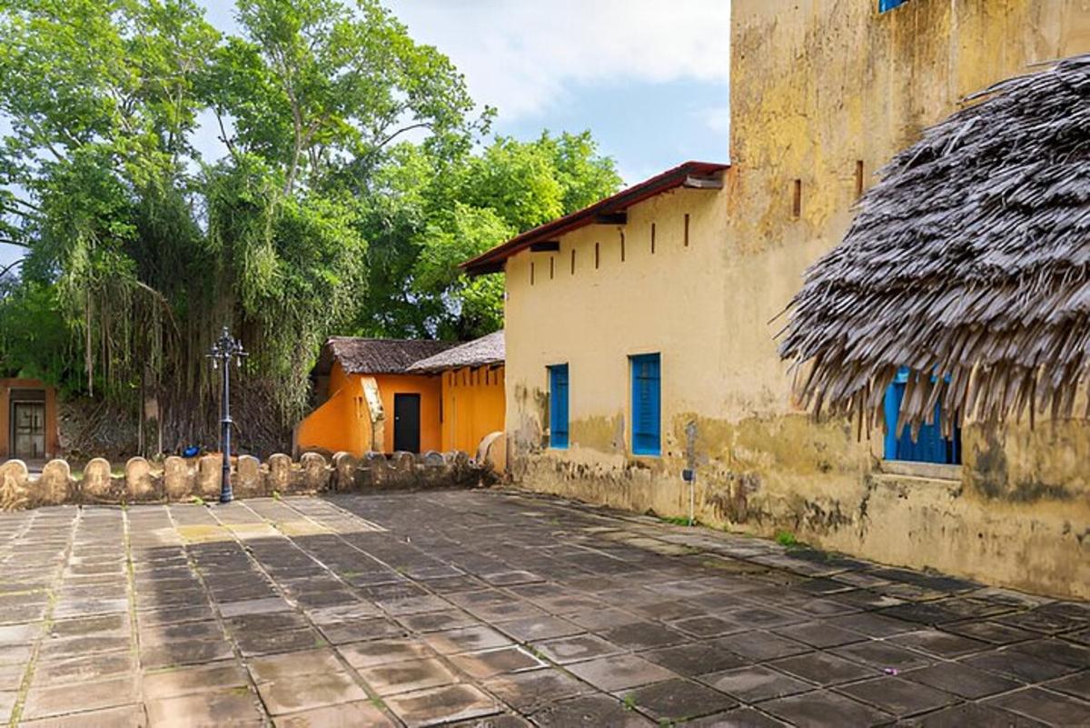 a building with a stone courtyard in front of it