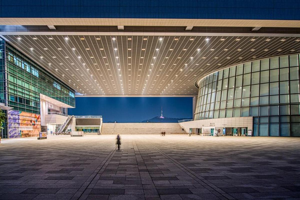 a person standing in front of a large building