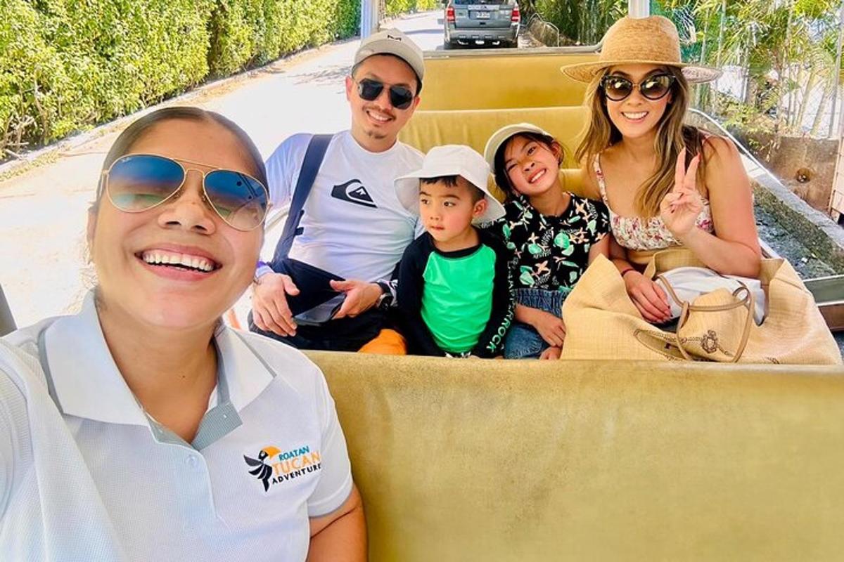a family sitting in the back of a truck