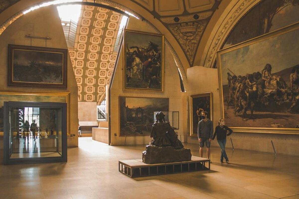 a museum with a statue in a room with paintings