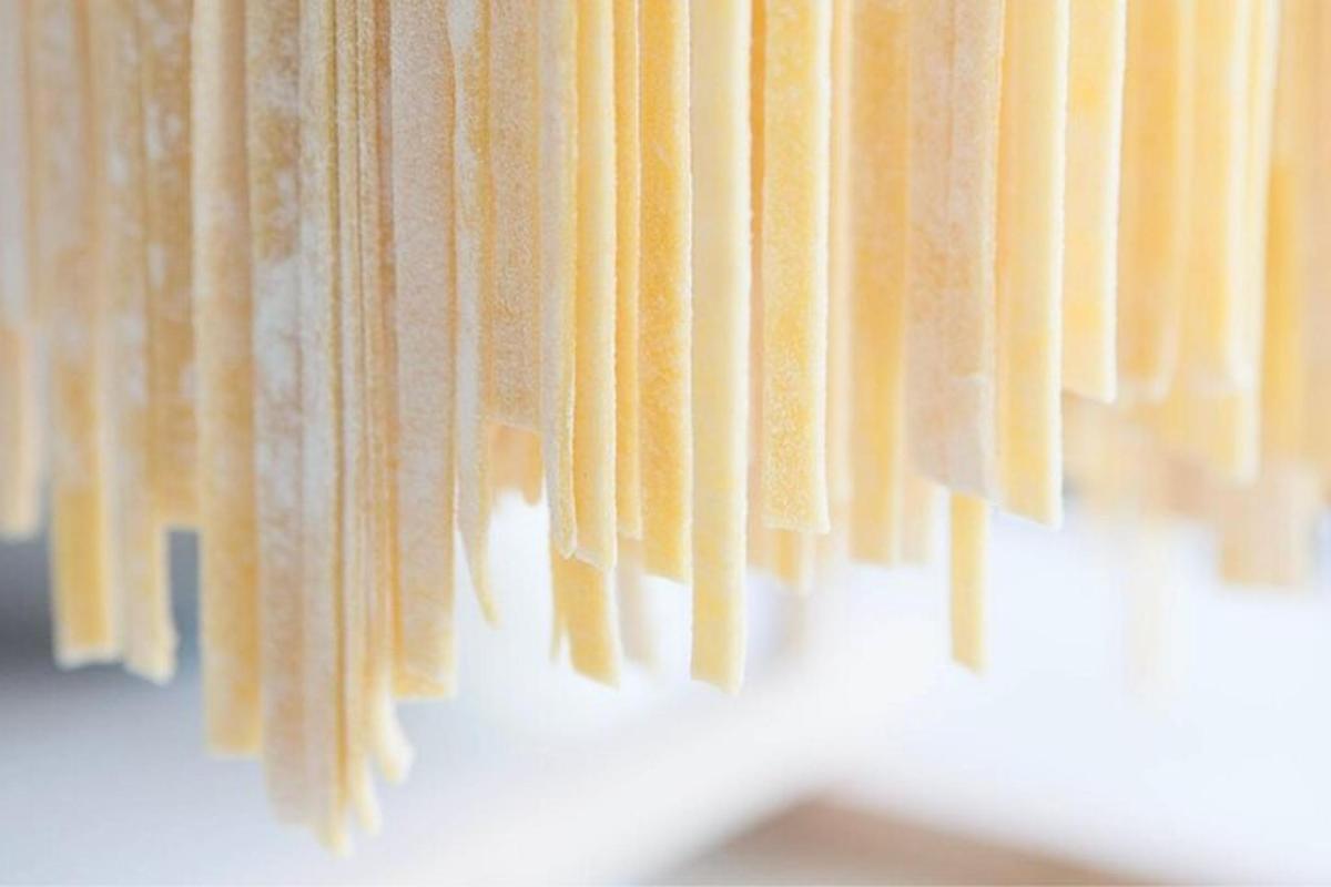 a bunch of yellow curtains hanging from a wall