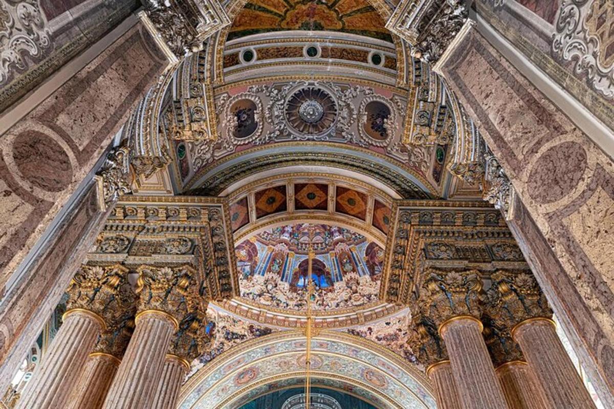 a ceiling of a building with paintings on it