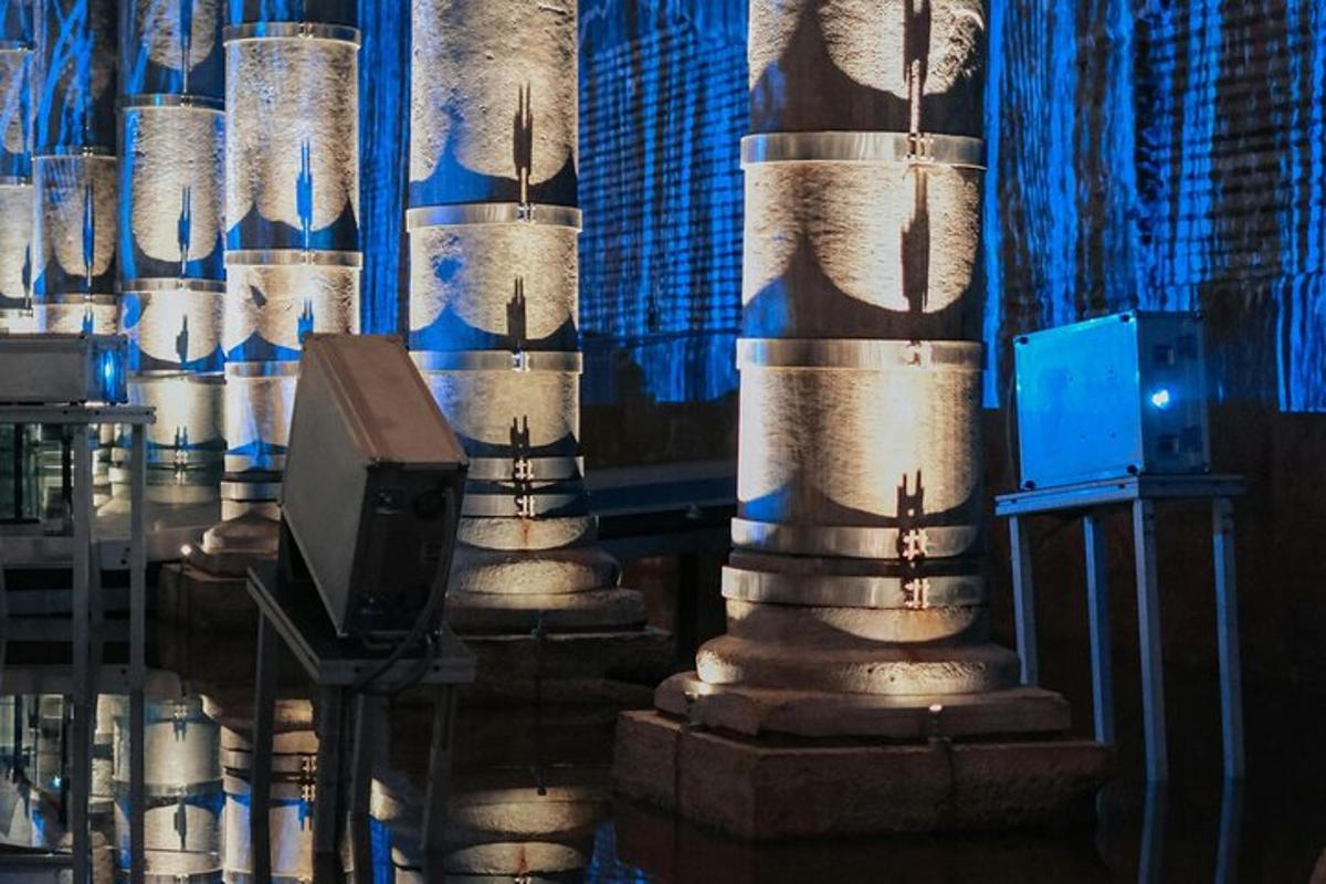 a group of columns in a room with a tv