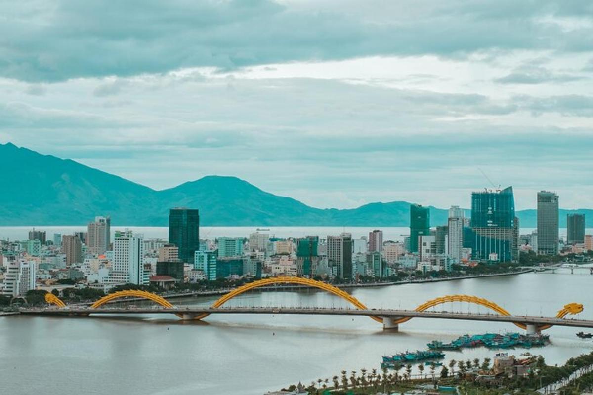 a large city with a bridge in the water