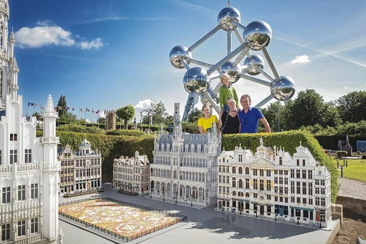 a family poses in front of a replica of the white house