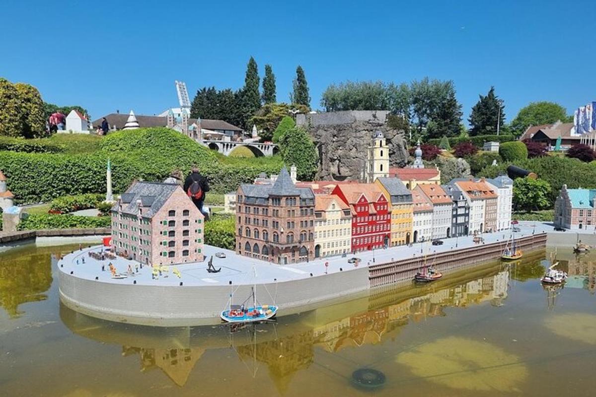 a model of a city with a boat in the water