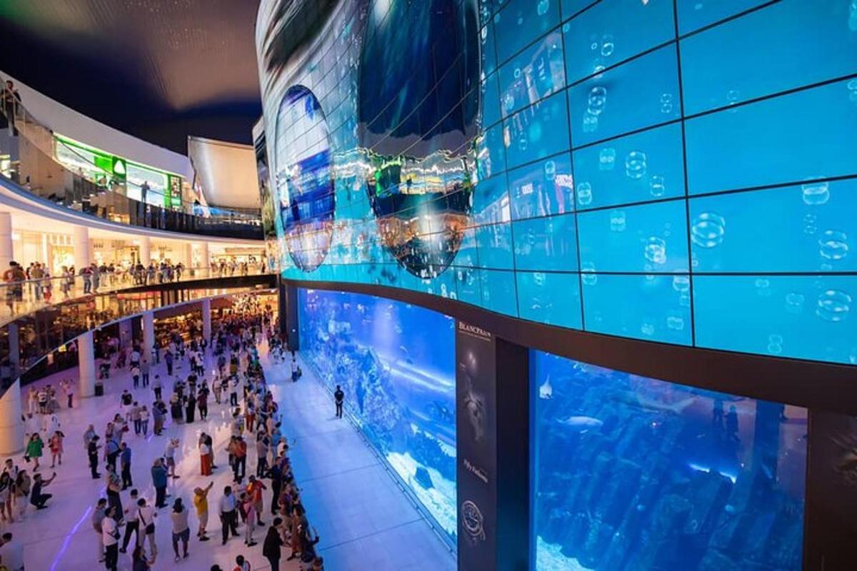 a large crowd of people in a shopping mall