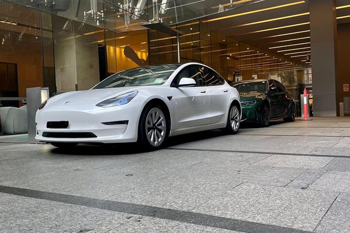 a white car parked in a parking garage