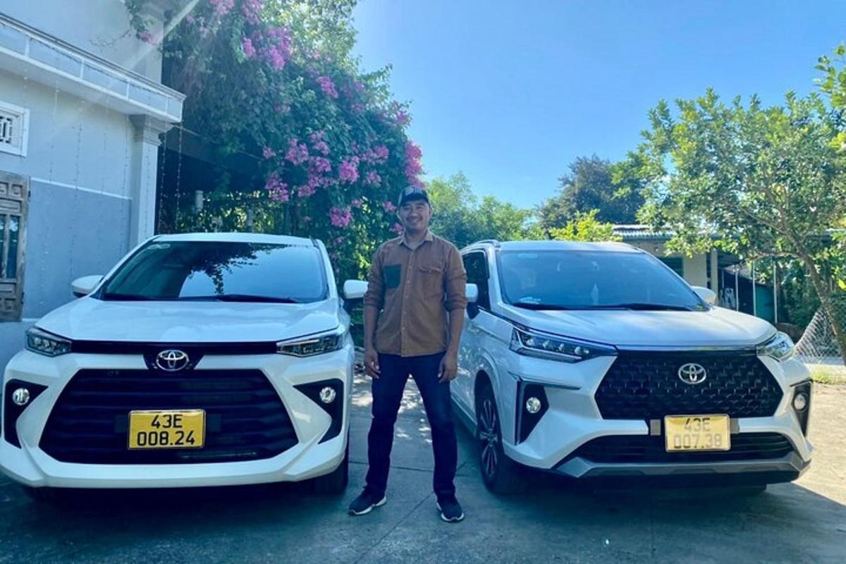 en mann som står ved siden av en hvit Lexus-lastebil