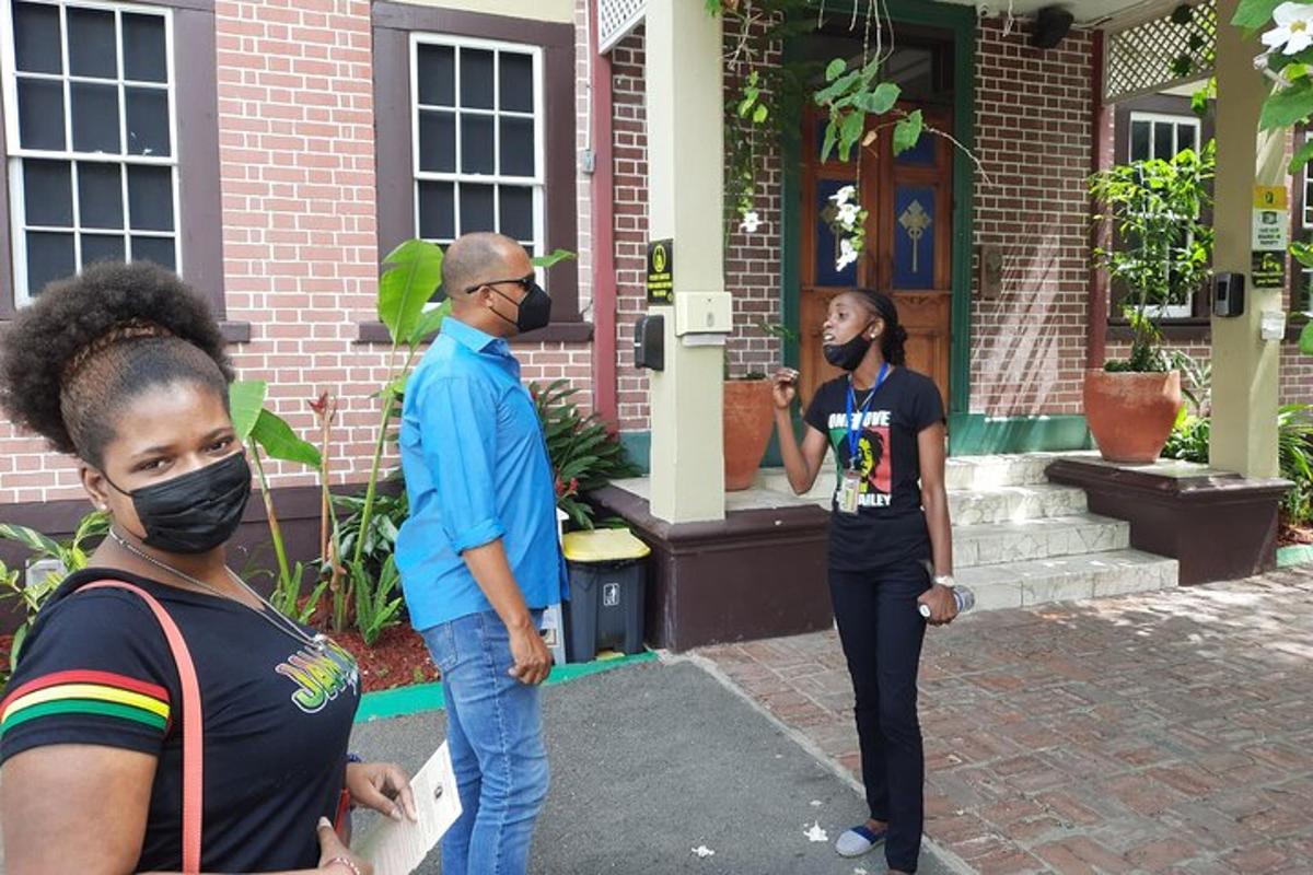 a group of people standing outside of a house
