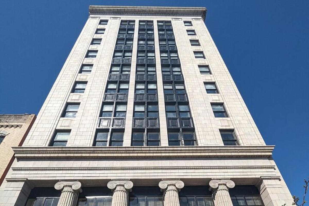 a tall white building with a lot of windows